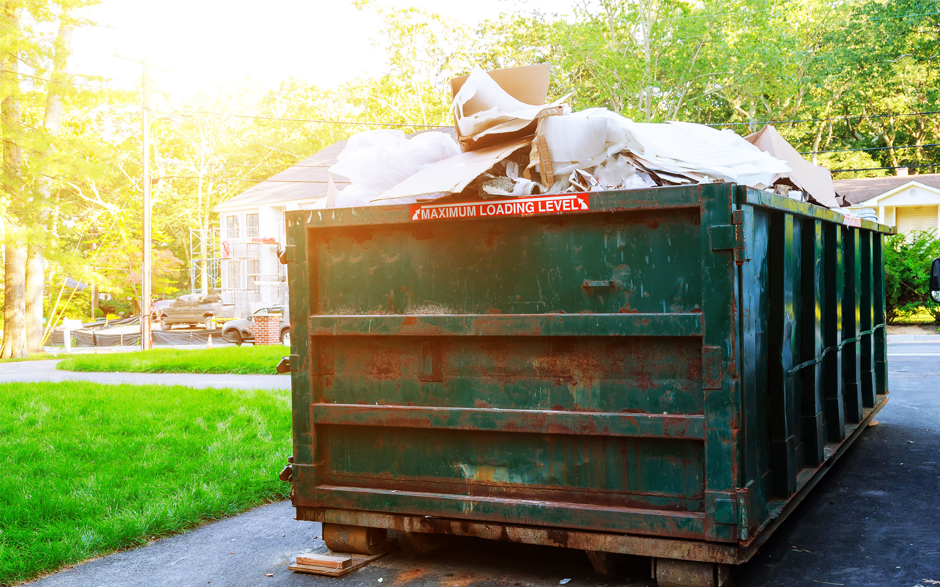 Residential junk removal service with Tossit truck on-site.